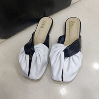 Chic White & Black Twist-Front Slip-On Flats – Minimal Elegance